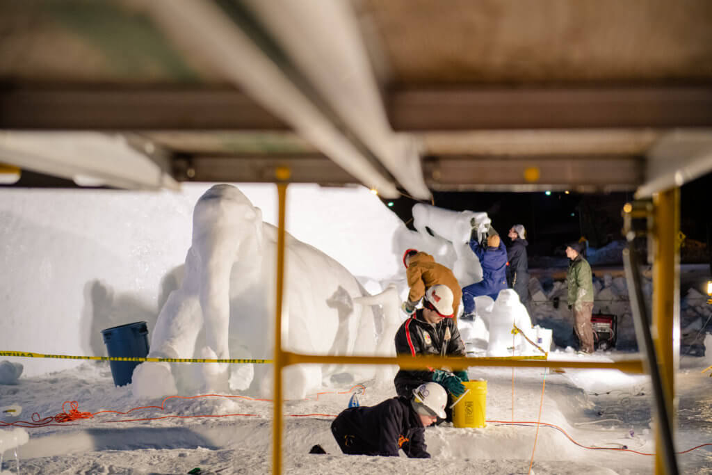 students at Michigan Tech working on sculptures during the Winter Carnival All-Nighter